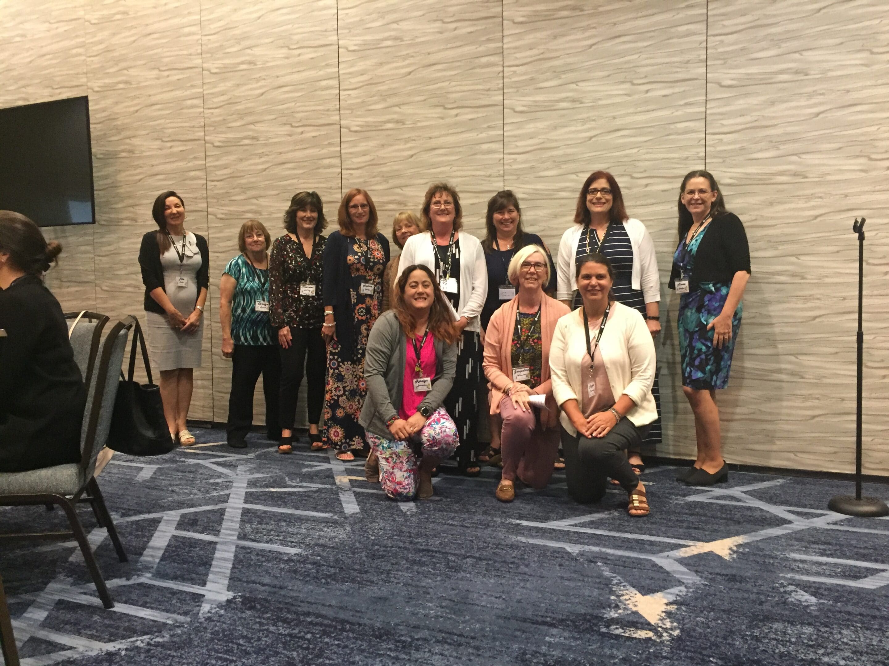 Group of women smiling for photo.